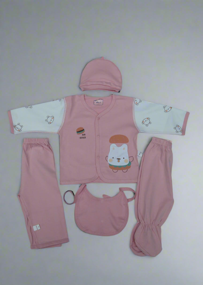 Baby clothing set with pink outfit, pants, bib, and hat on a white background