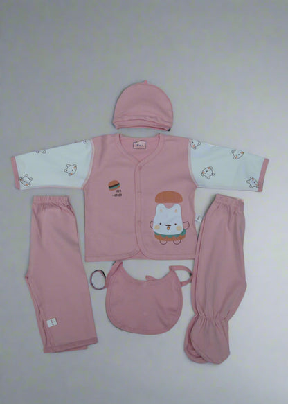 Baby clothing set with pink outfit, pants, bib, and hat on a white background