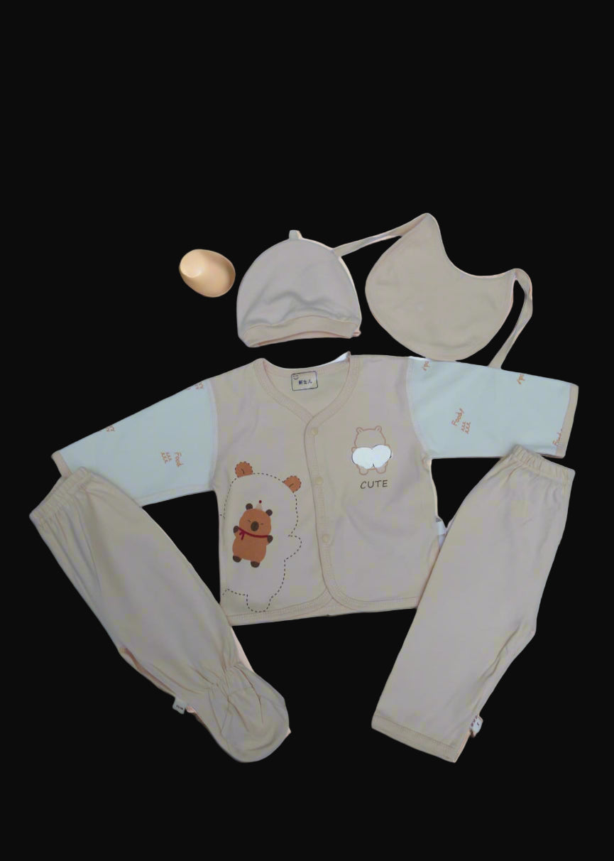 Baby clothing set with a bear design on a white background