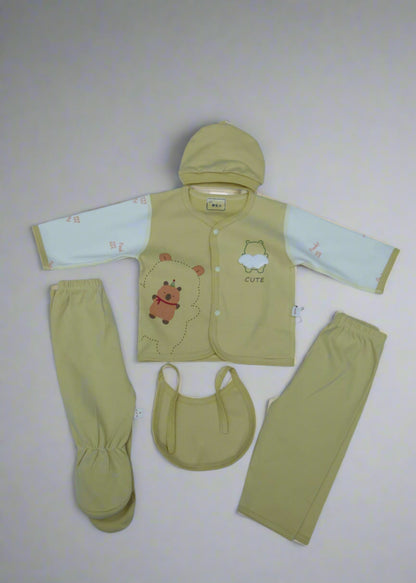 Set of baby clothing including a jacket, pants, and bib on a white background