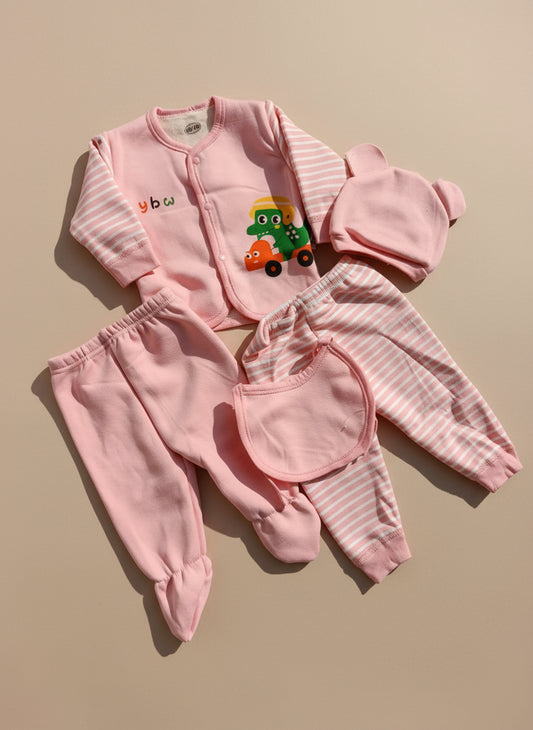 Pink baby outfit set with a hat, jacket, and pants on a beige surface