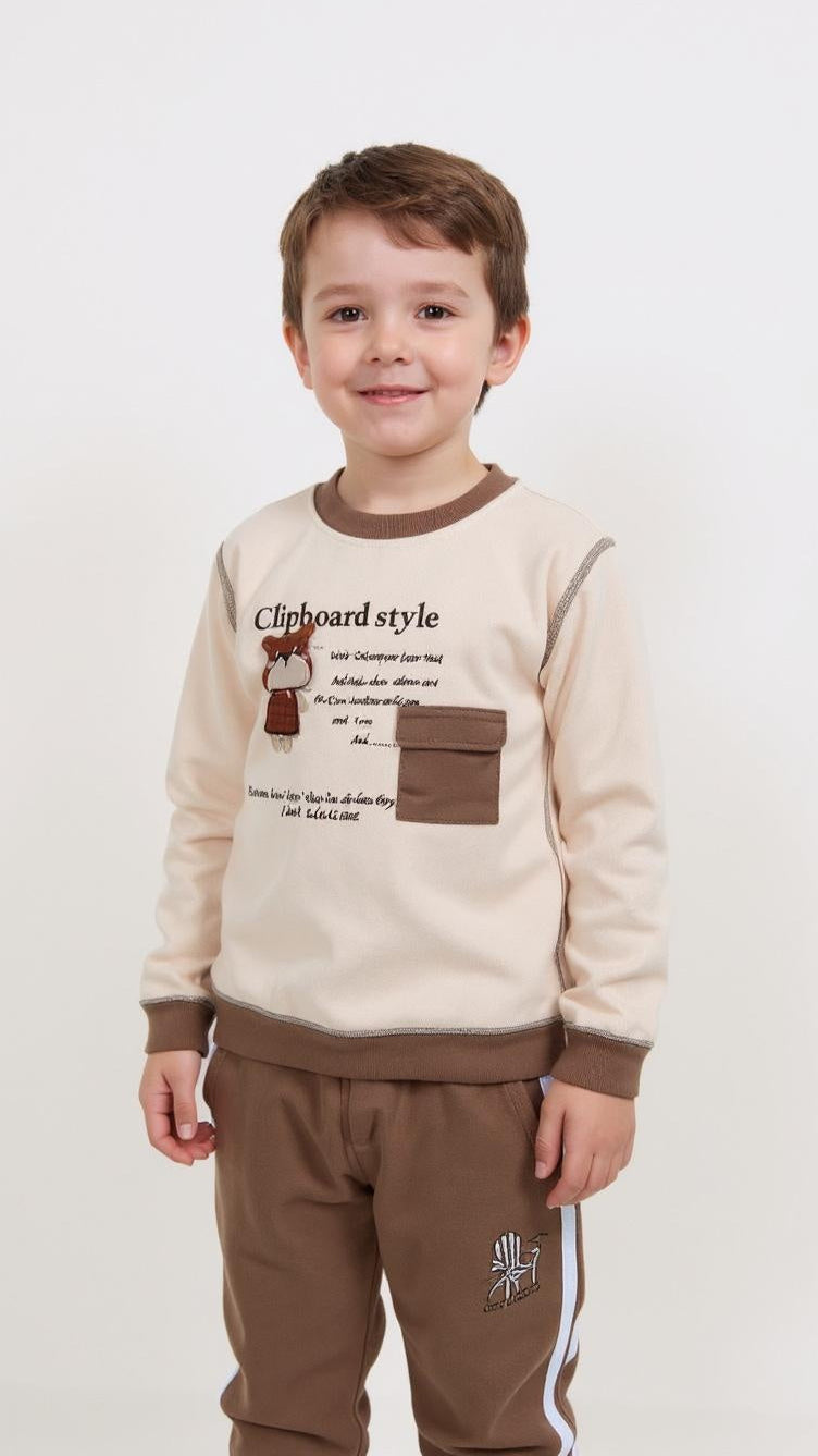 Child wearing a beige and brown outfit with text and graphics on a white background