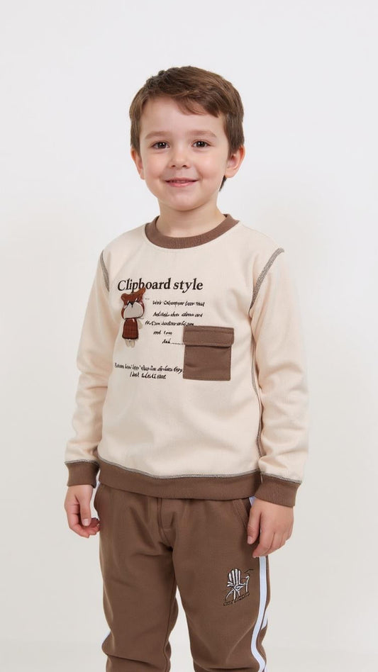 Child wearing a beige and brown outfit with text and graphics on a white background